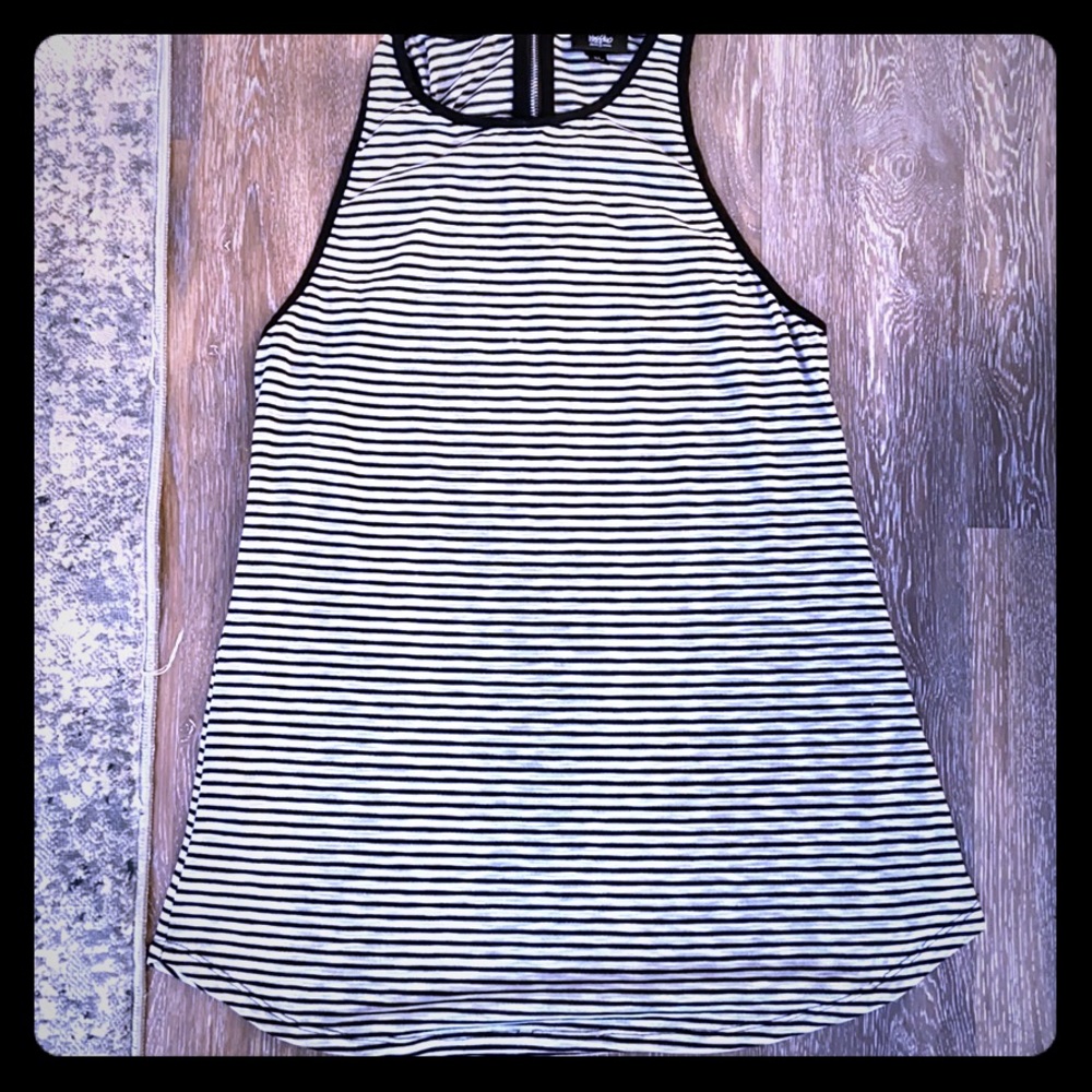 Tunic length tank top with back supper closure.